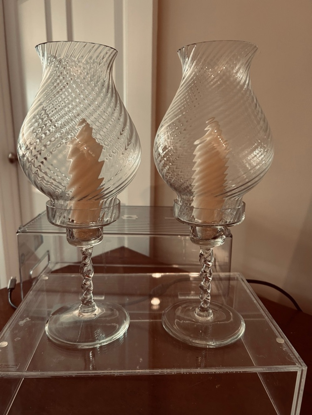 Two crystal candle holders.